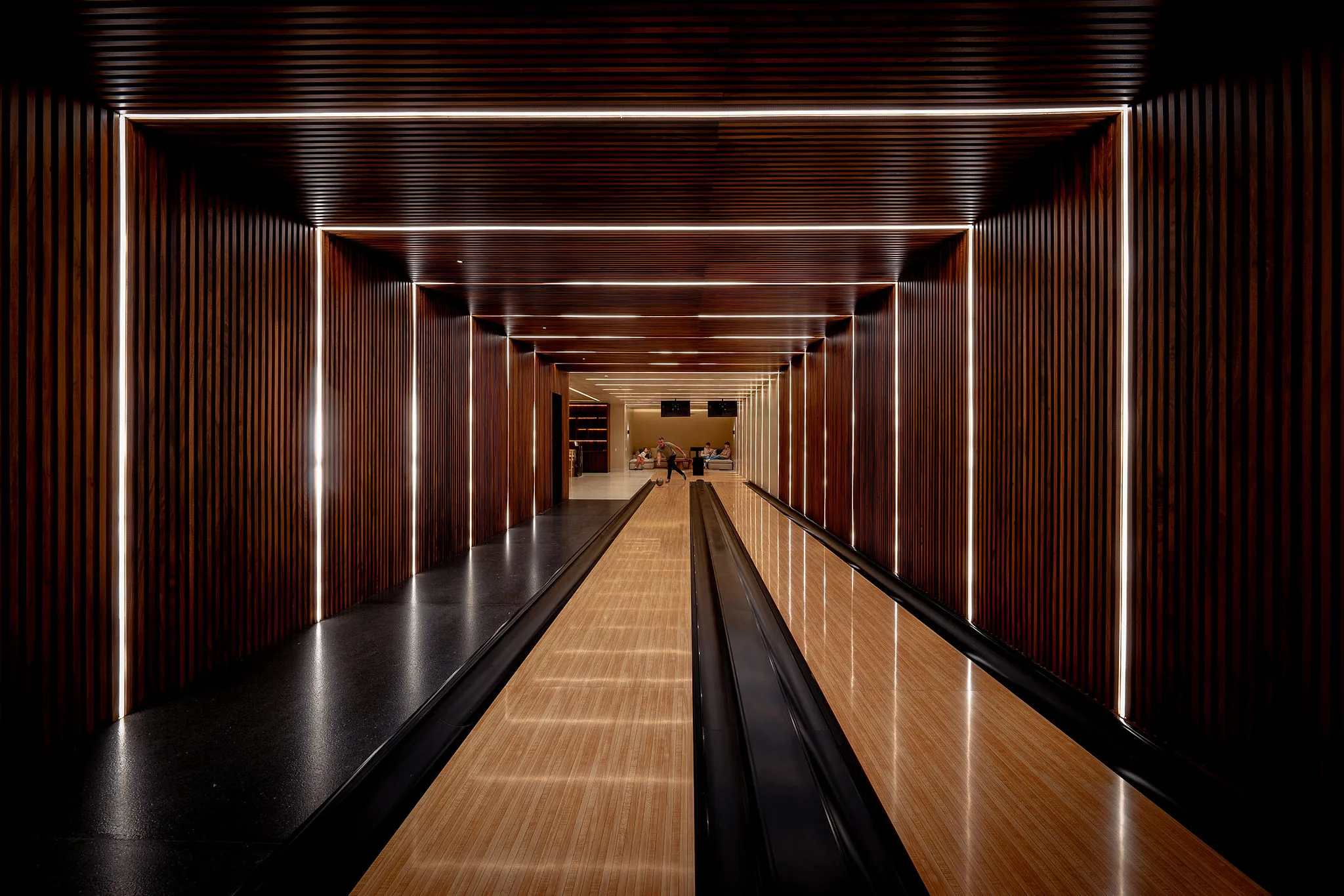 Chic bowling alley in Ranchos Estates, Punta Mita, with wood lanes, sleek lighting, and modern Casa Happy Paws-style design.