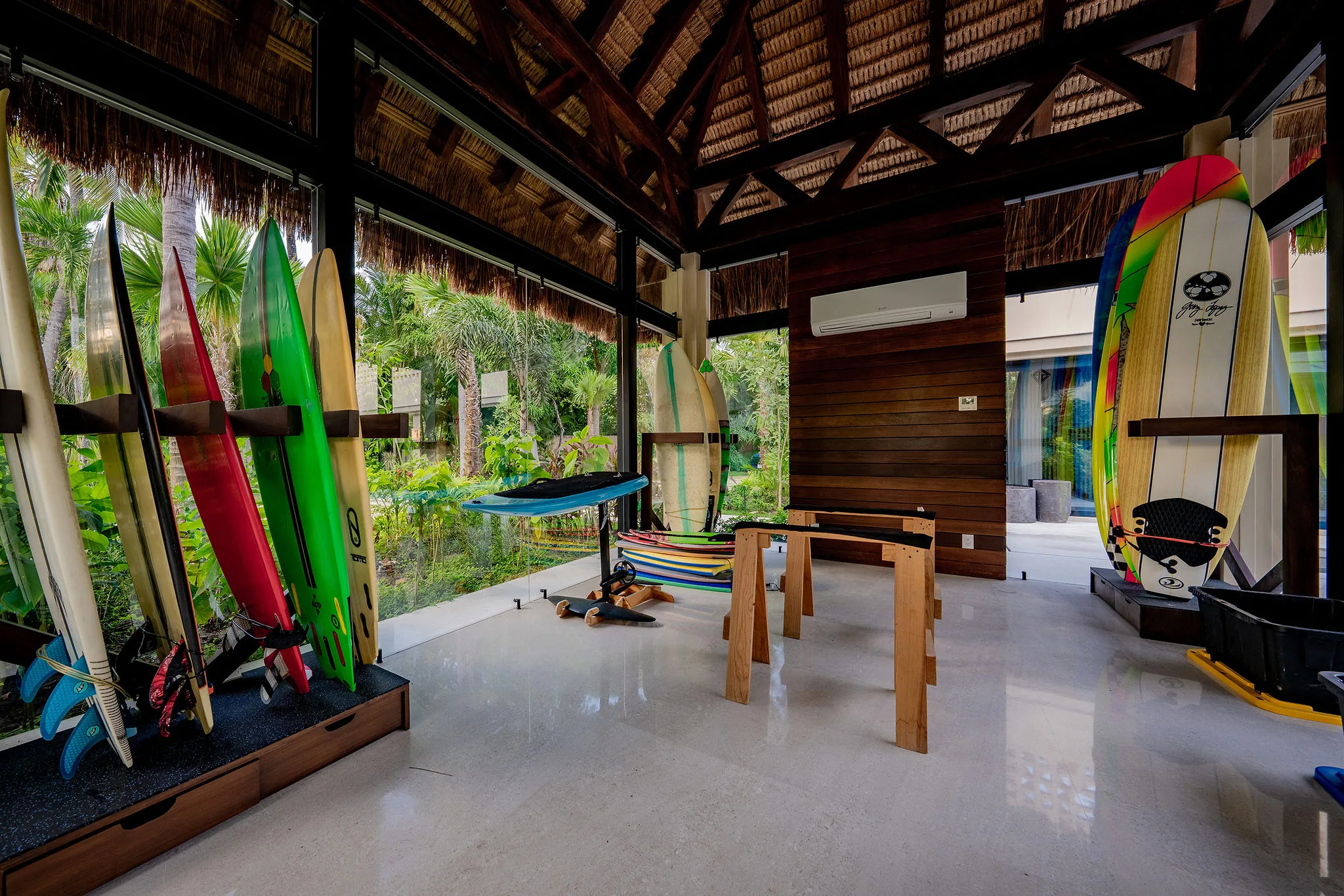 Casa Happy Paws, Punta Mita: tropical open-air room, big windows, surfboards, wood beams, foosball table, lush Ranchos Estates views.
