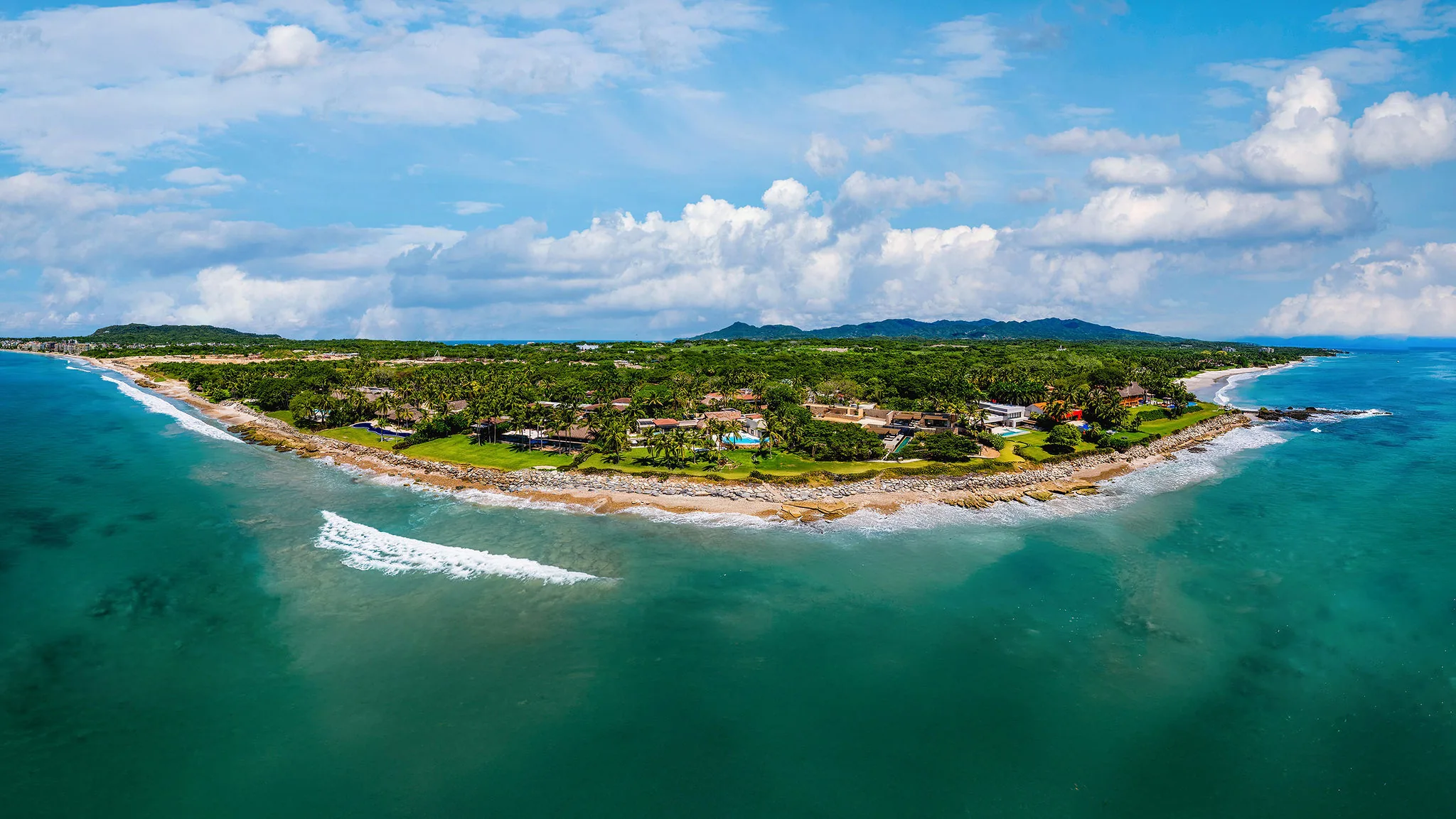 Aerial view of Punta Mita, Ranchos Estates, Mexico coastline with turquoise water, sandy beaches, and Casa Happy Paws.