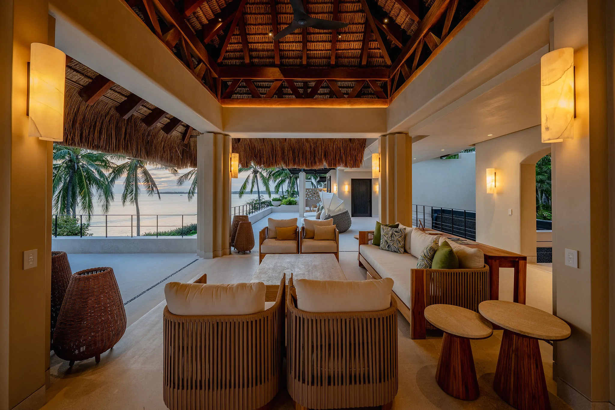 Casa Happy Paws, Punta Mita: Open-air luxe living room, wood decor, thatched roof, ocean sunset views in Ranchos Estates.