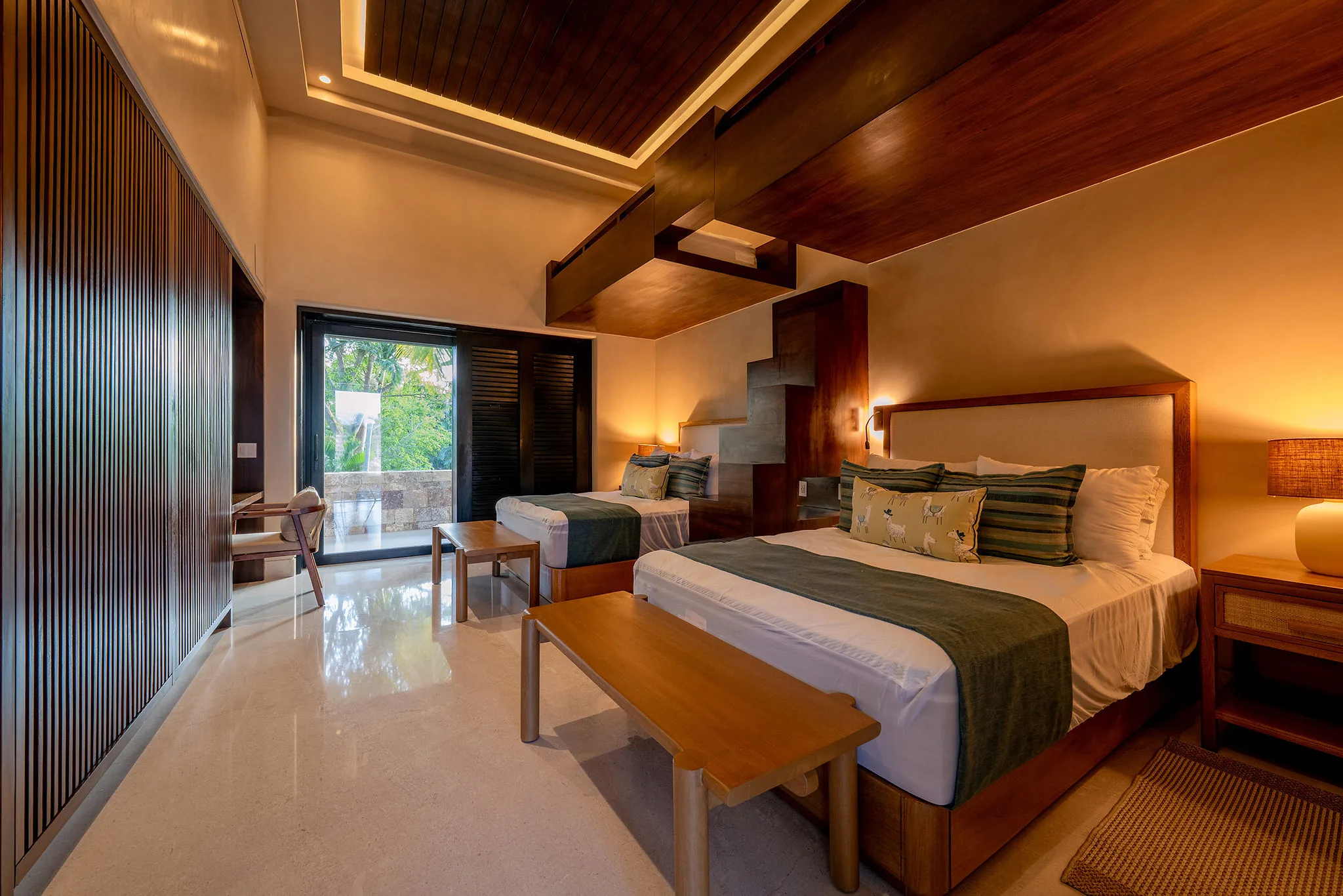Chic Punta Mita room, two double beds, wood accents, patio to lush views—ideal Ranchos Estates retreat.