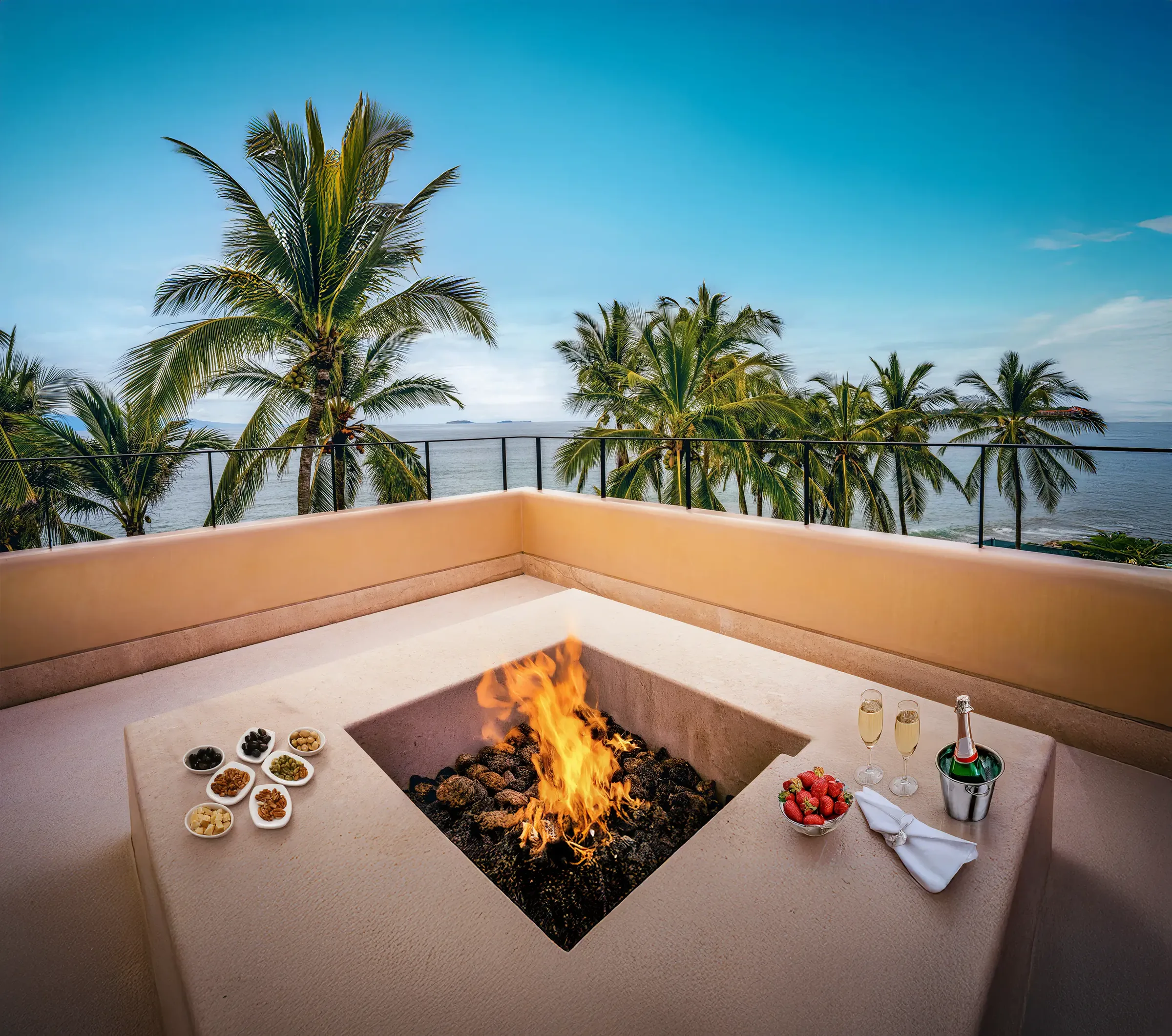 Casa Happy Paws rooftop terrace in Punta Mita’s Ranchos Estates: fire pit, snacks, champagne, ocean and palm views.