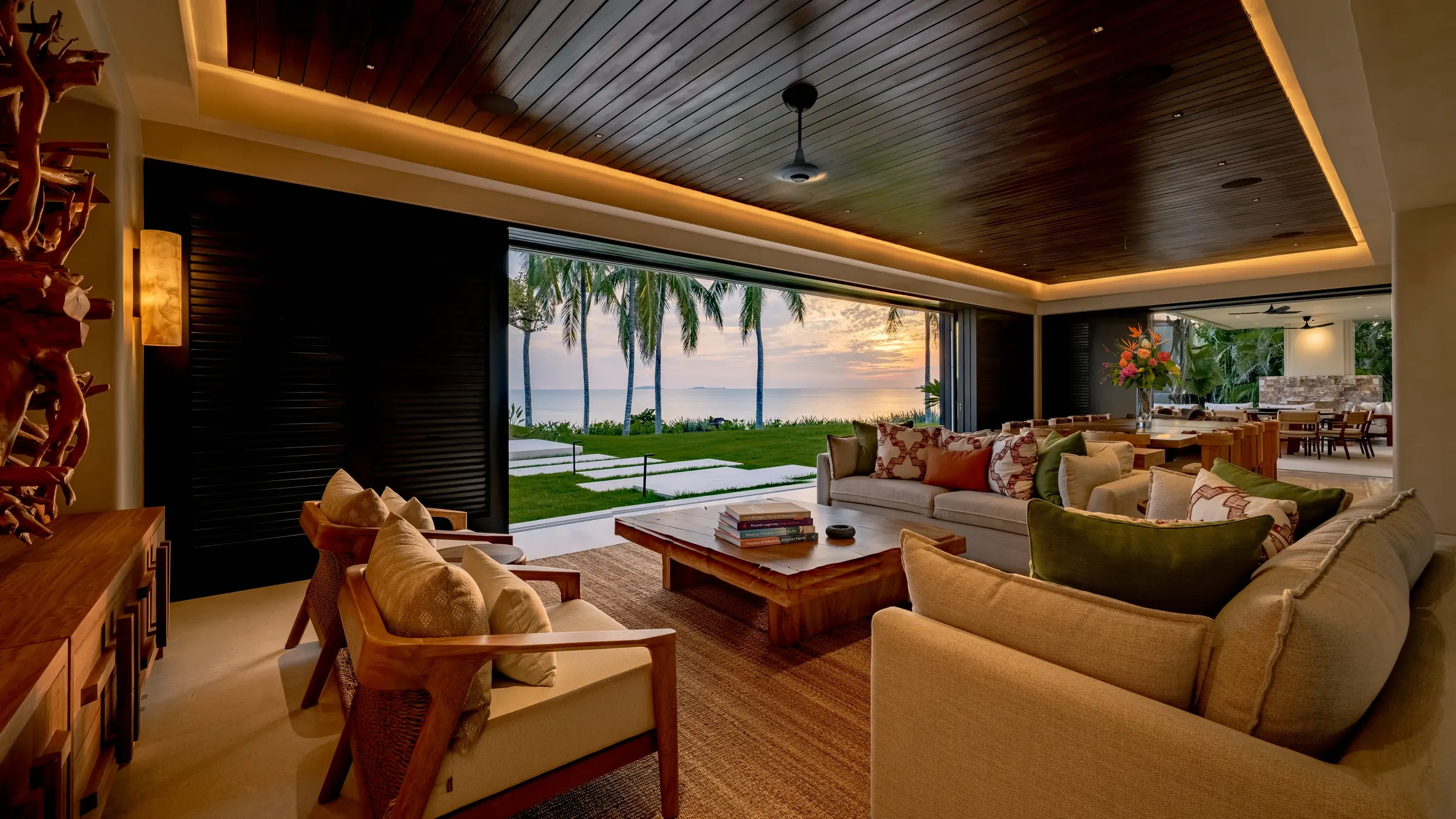 Luxurious open living room at Casa Happy Paws, Ranchos Estates, Punta Mita, boasts ocean sunset views and elegant decor.