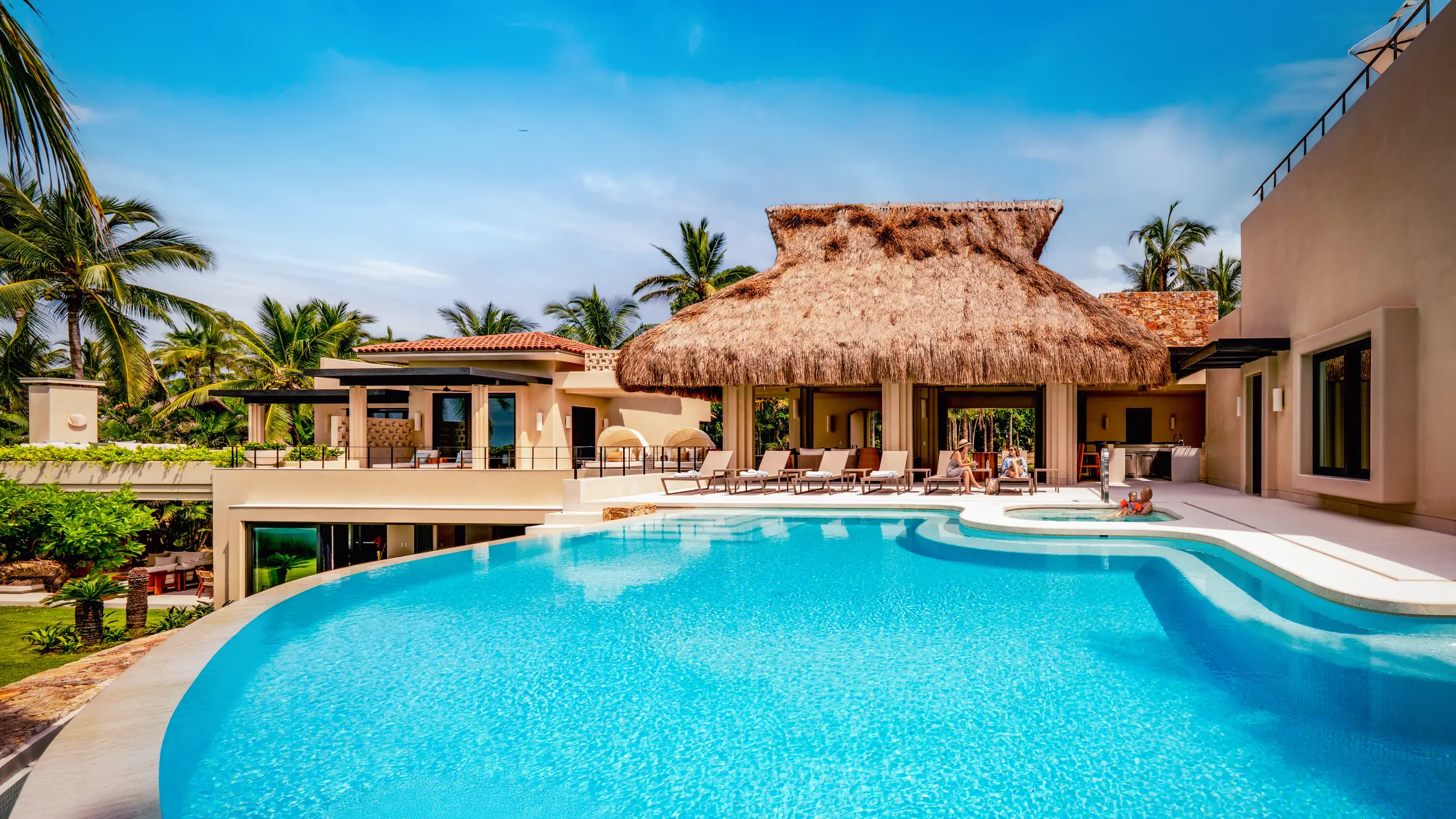 Casa Happy Paws: Punta Mita villa with infinity pool, cabana, lounge chairs, palms, and spacious outdoor areas in Ranchos Estates.